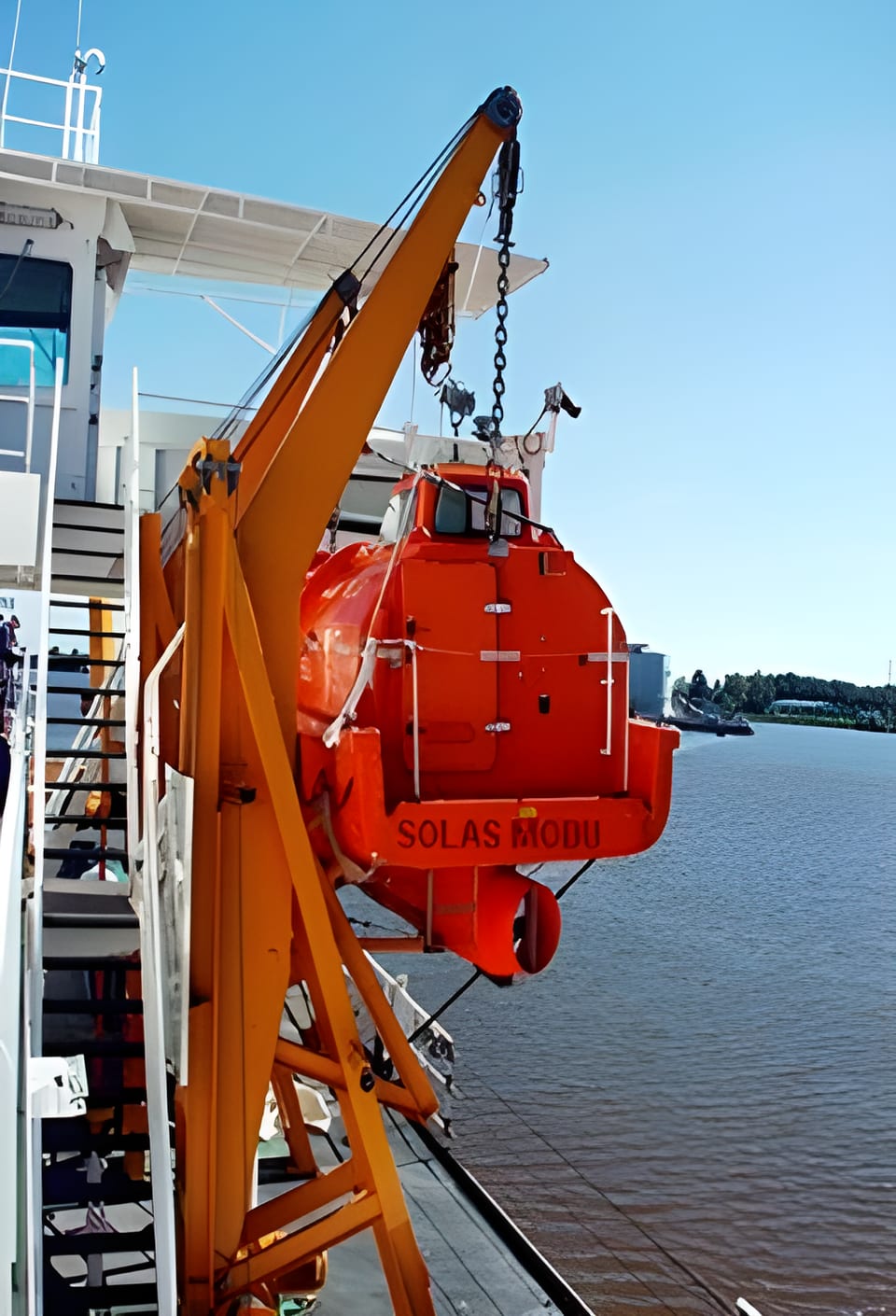 Enclosed lifeboat photographed during an early SOLAS MODU servicing project
