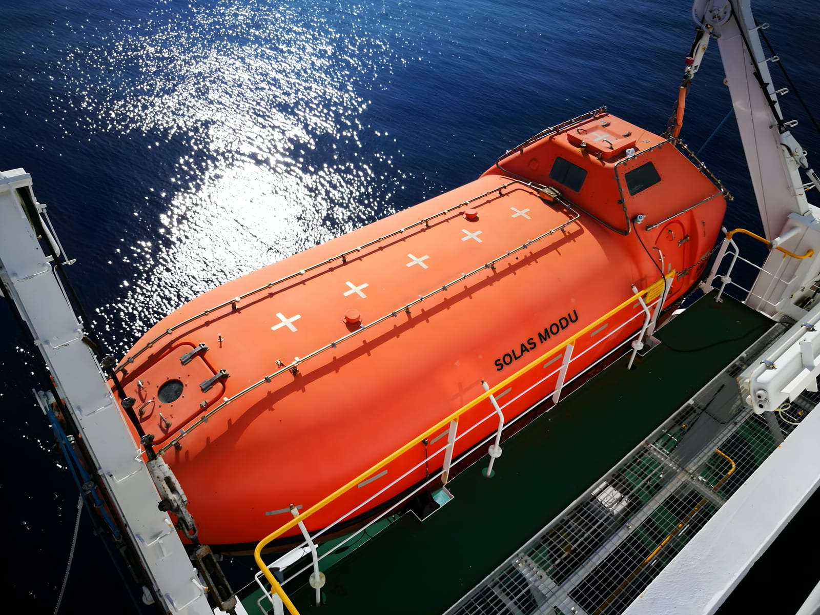 SOLAS MODU crew deploying a lifeboat during a survival systems exercise